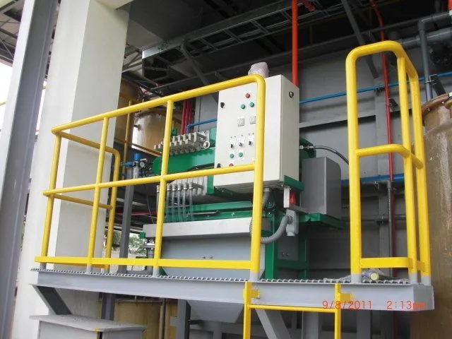 Filter press on a raised platform with control panel