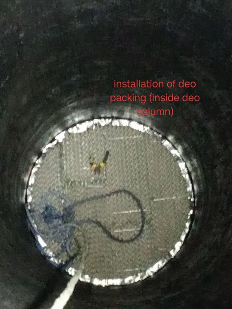 Structured packing being installed in a column